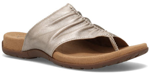 A gold thong sandal.