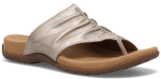 A gold thong sandal.