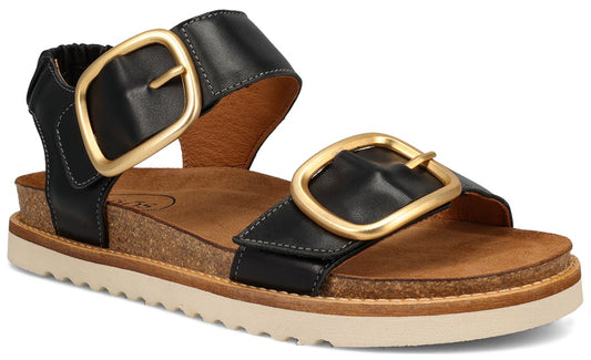 Black leather sandals with oversized gold buckles and cork soles.