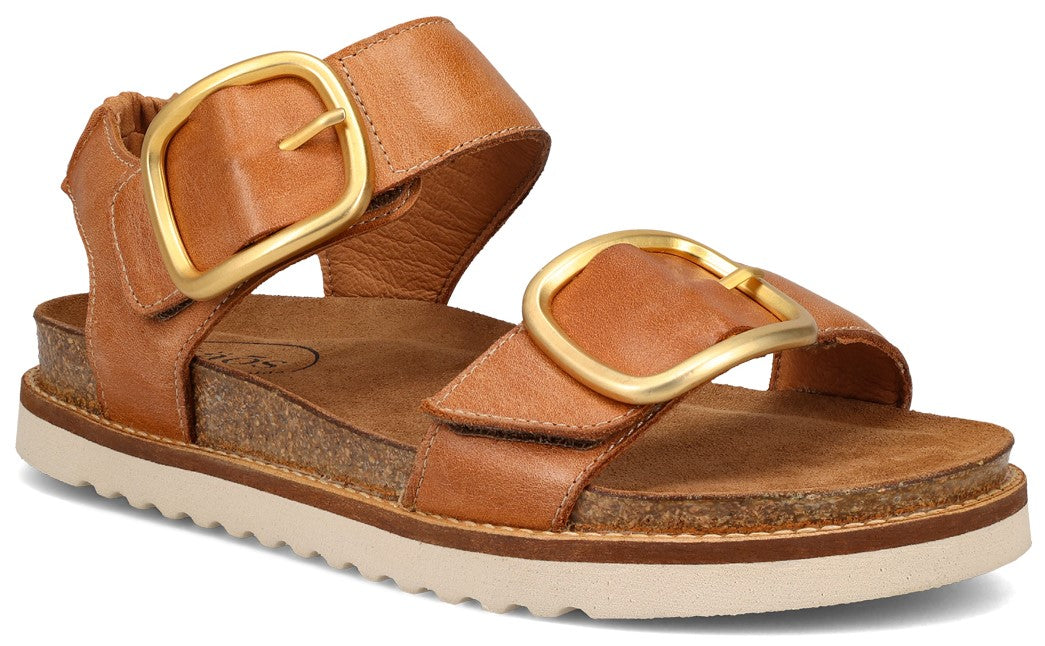 Tan sandal with two straps and gold buckles, set on a cork footbed and white rubber sole.