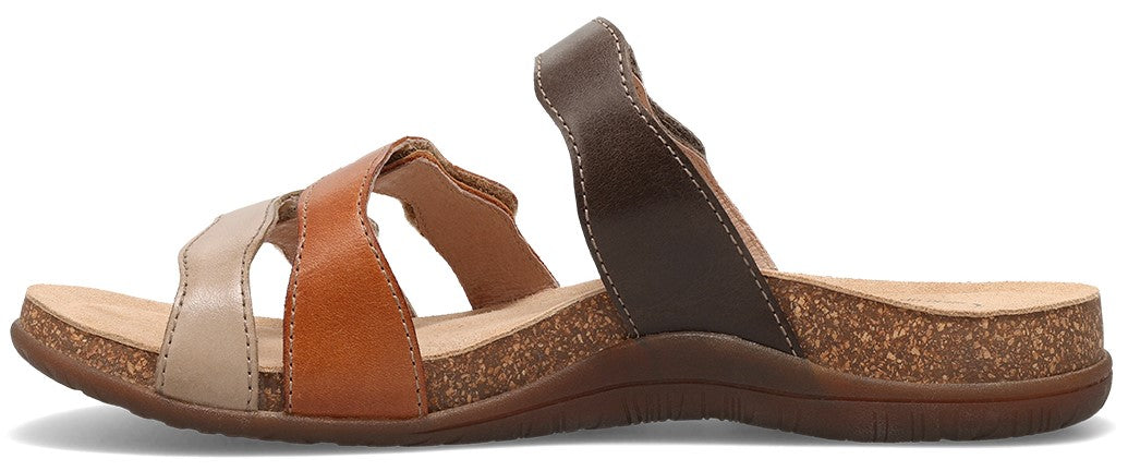A sandal with beige, brown, and tan straps and a cork footbed.