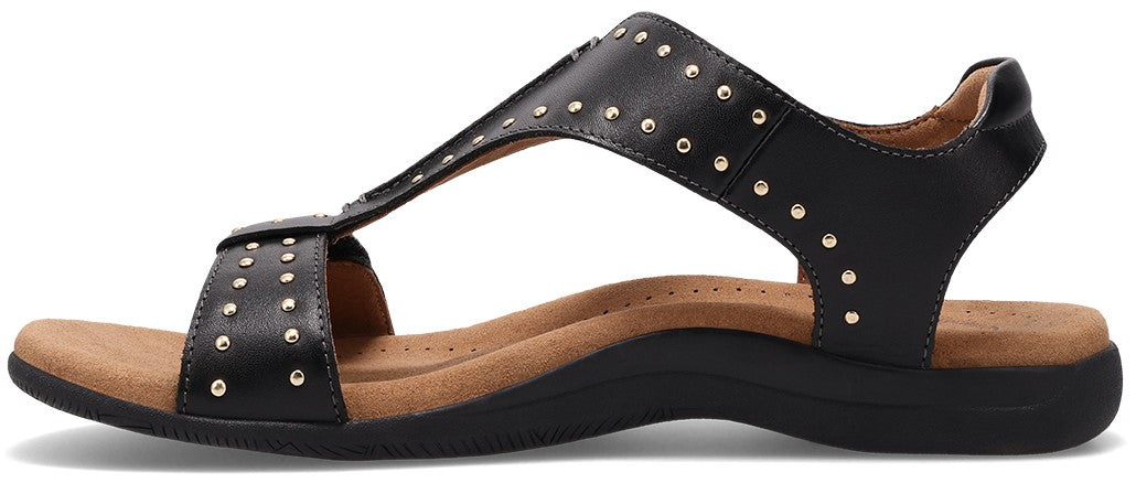 Black sandal with studded straps and flat sole.