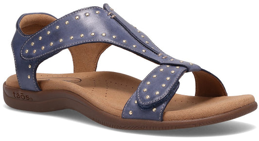 Blue leather flat sandal with metallic stud details.