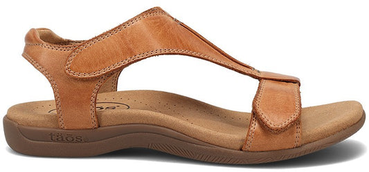 A tan-colored leather sandal with a t-strap and velcro closures.