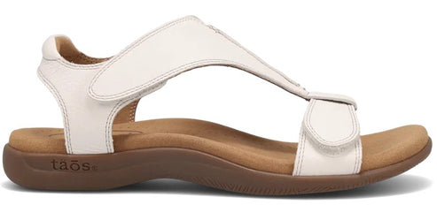 A white sandal with adjustable straps.