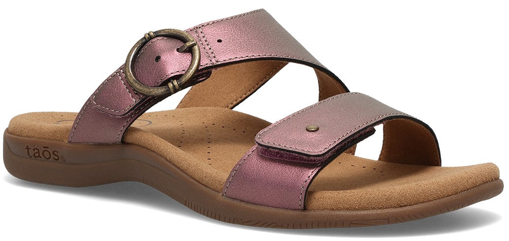 A pink sandal with two straps, one with an adjustable buckle.