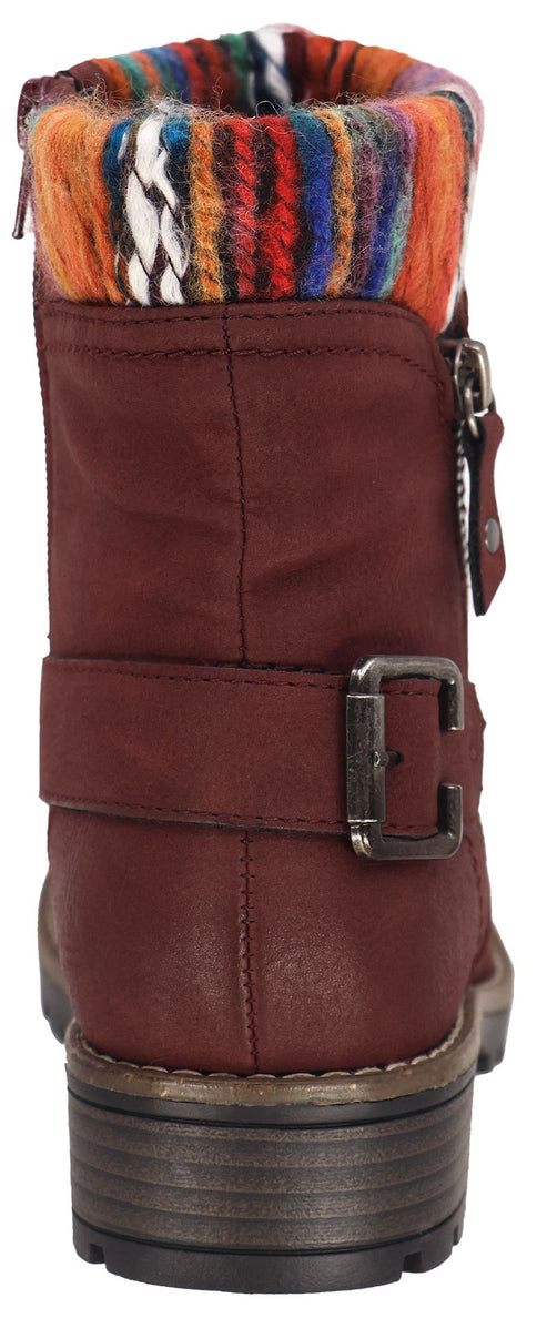 A reddish-brown ankle boot with a decorative buckle, side zipper, and a multicolored, knit cuff.