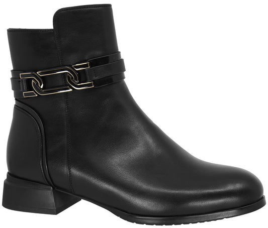 A black leather ankle boot with a rounded toe, a block heel, and a decorative metallic chain link strap across the ankle.