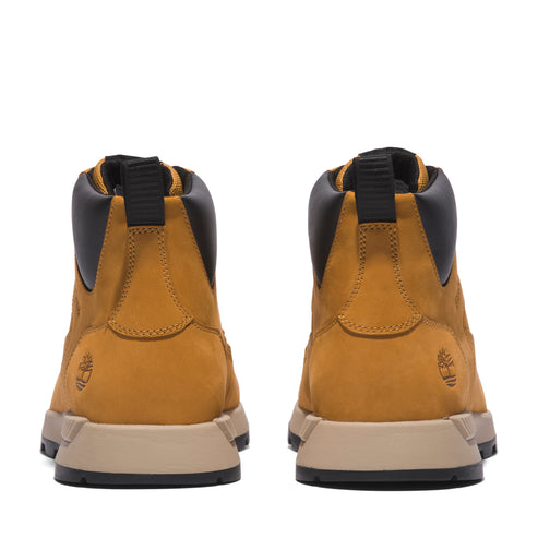 Back view of two golden tan hiking boots with black collars and midsoles.
