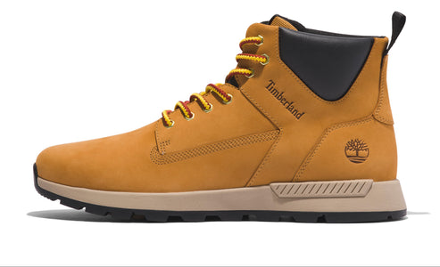 Side view of a tan hiking boot with yellow and red laces, a black collar, and the text "Timberland" above a tree logo.