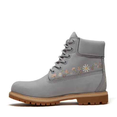 A gray boot with flower embroidery.