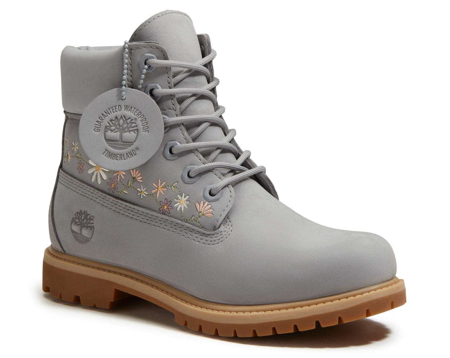Gray leather boot with floral embroidery near the ankle and a thick, ridged sole.