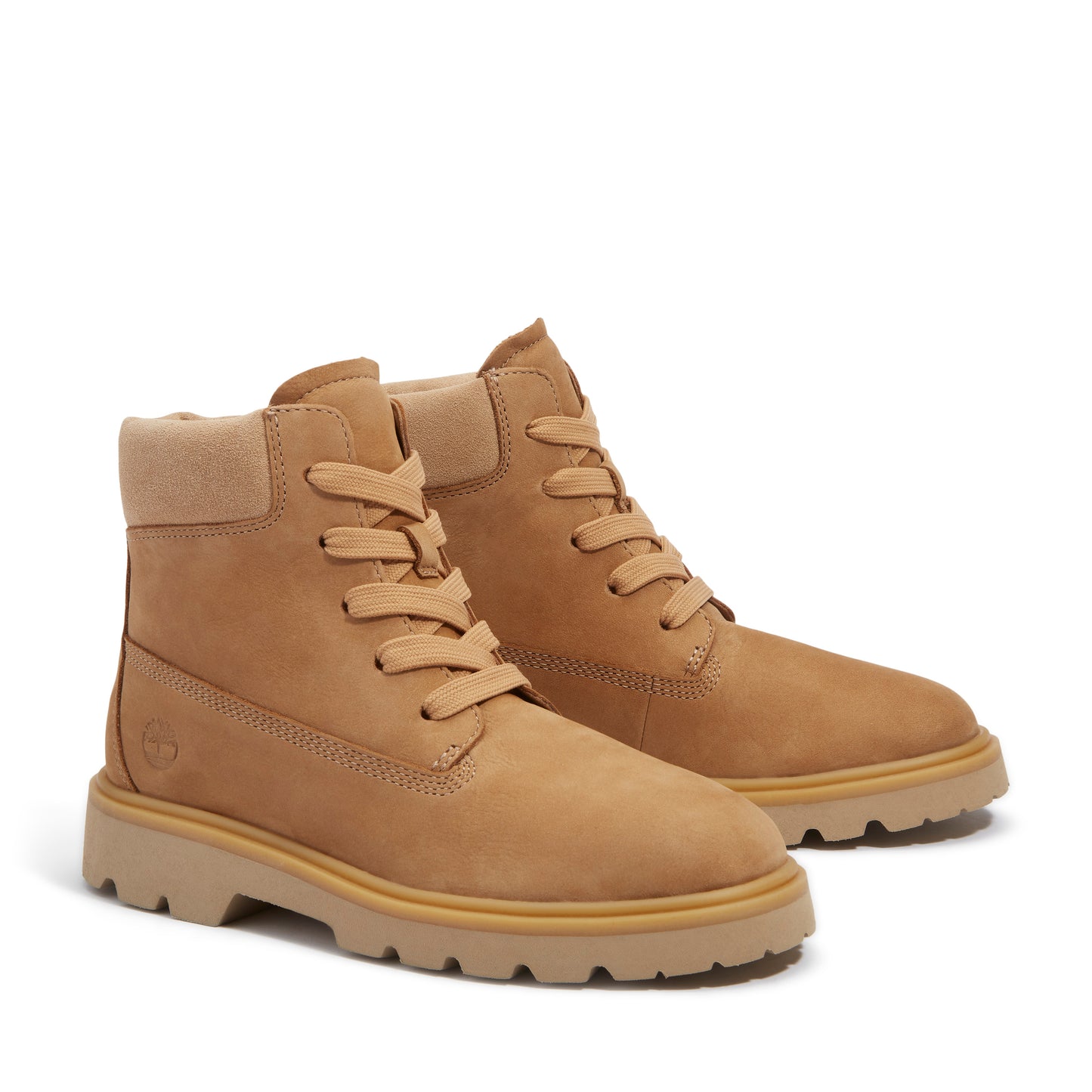 Pair of tan lace-up boots with light-colored soles.