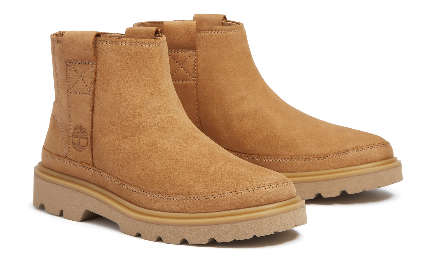 Pair of tan Chelsea boots with a lug sole.