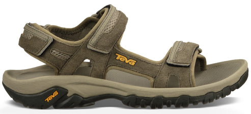 A Teva sandal in olive green with a velcro closure.