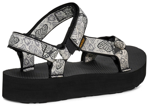 Platform sandal with gray and white straps.