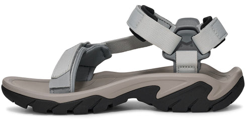 Side view of a sandal with grey fabric straps and a thick grey and black sole.