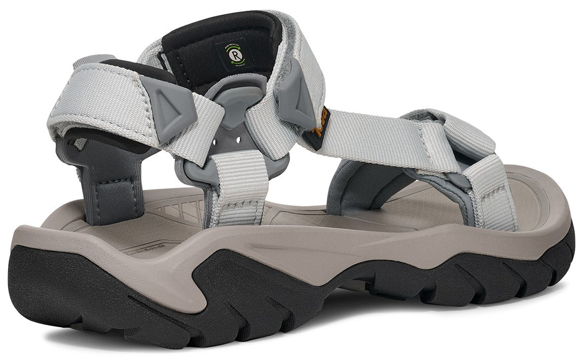 A gray adjustable sandal with a thick, black and gray sole.