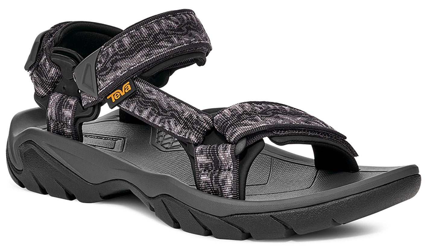 Black and grey patterned sandal with adjustable straps and thick sole.