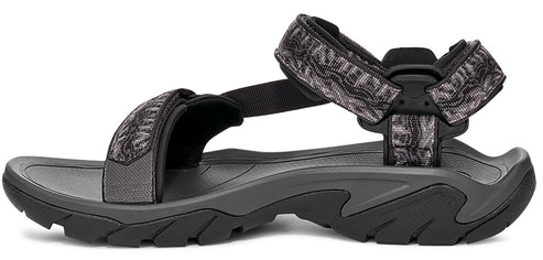 A sandal with gray and black straps and a contoured sole.