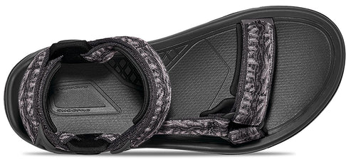 A gray and black sandal with patterned straps.