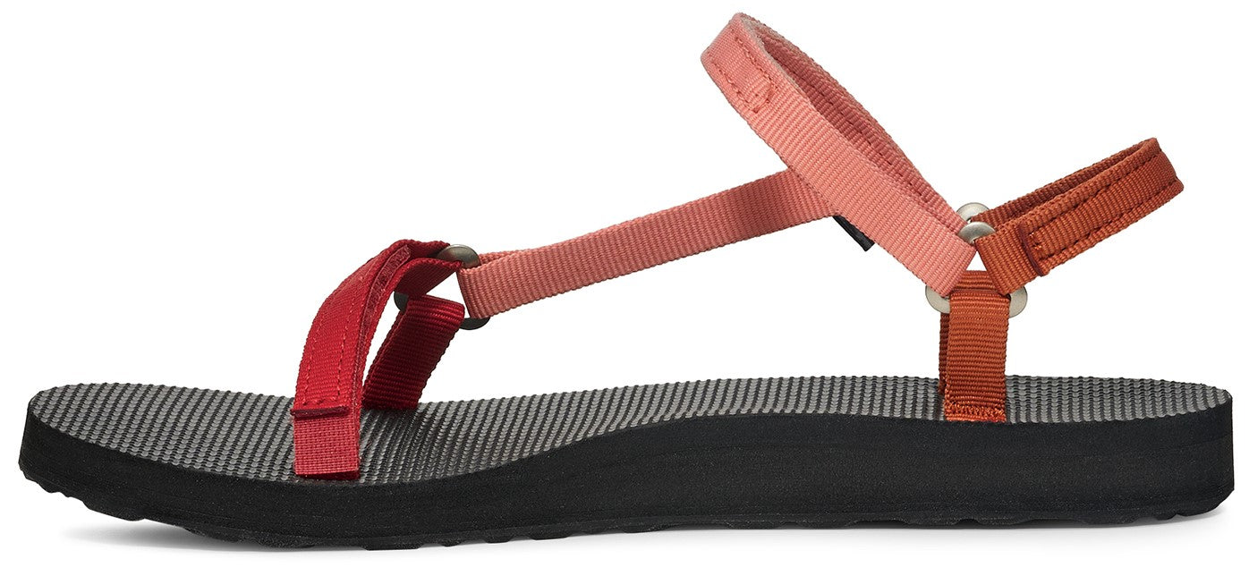 A sandal with a dark sole and red, pink, and brown straps.