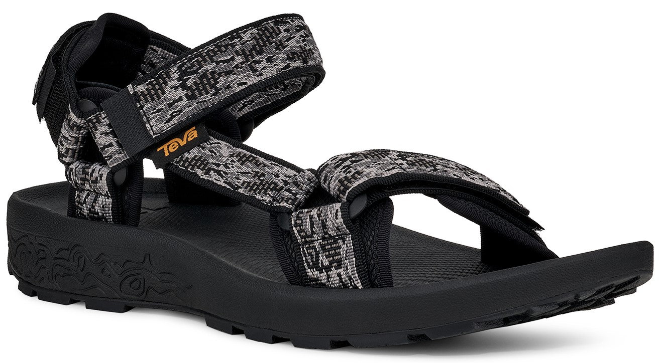 Black sandal with patterned gray, black, and white straps and a black sole.