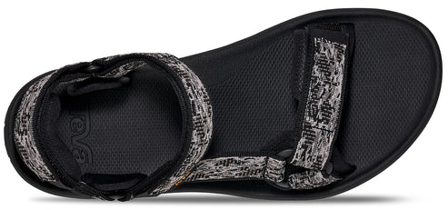A sandal with woven straps.