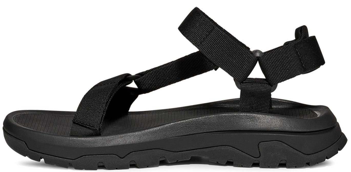 Black sandal with adjustable straps and a thick sole.