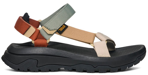 A multicolored sandal with thick straps and a black lug sole.