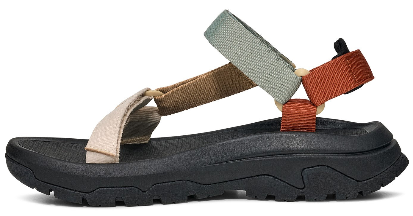 Sandals with a black sole and beige, brown, grey, and orange fabric straps.