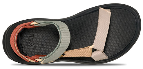 A sandal with textile straps over a black sole.