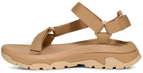 Tan colored chunky soled sandal with tan straps.
