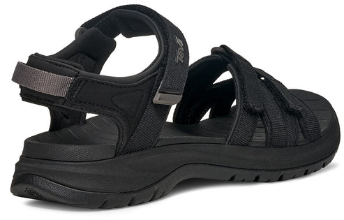Black sandal with multiple adjustable velcro straps and a thick sole.