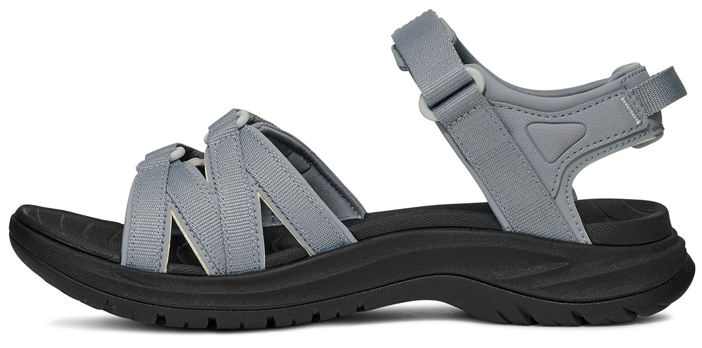 Gray sandal with velcro straps and black sole.