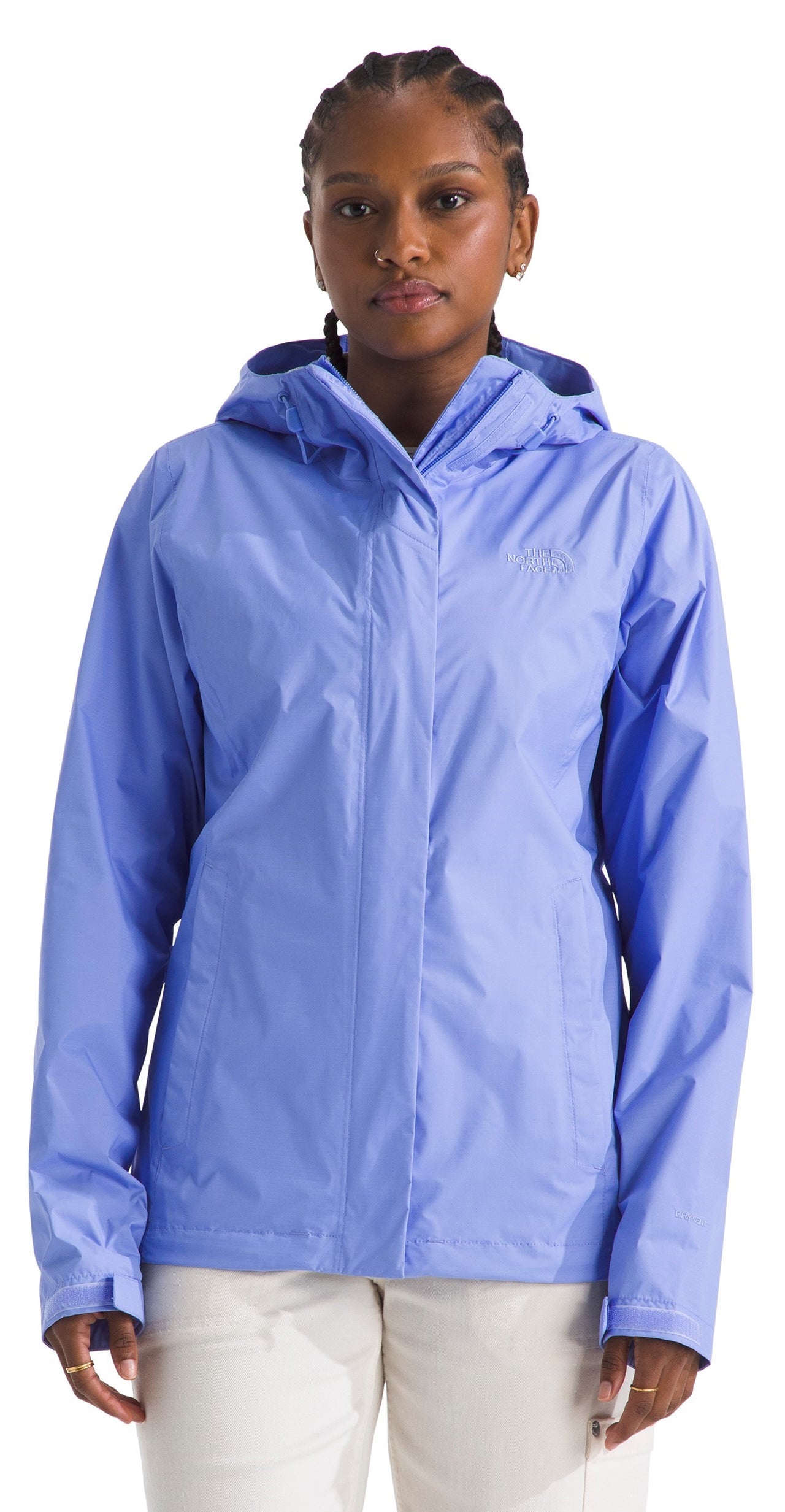 A woman wearing a light blue hooded jacket.
