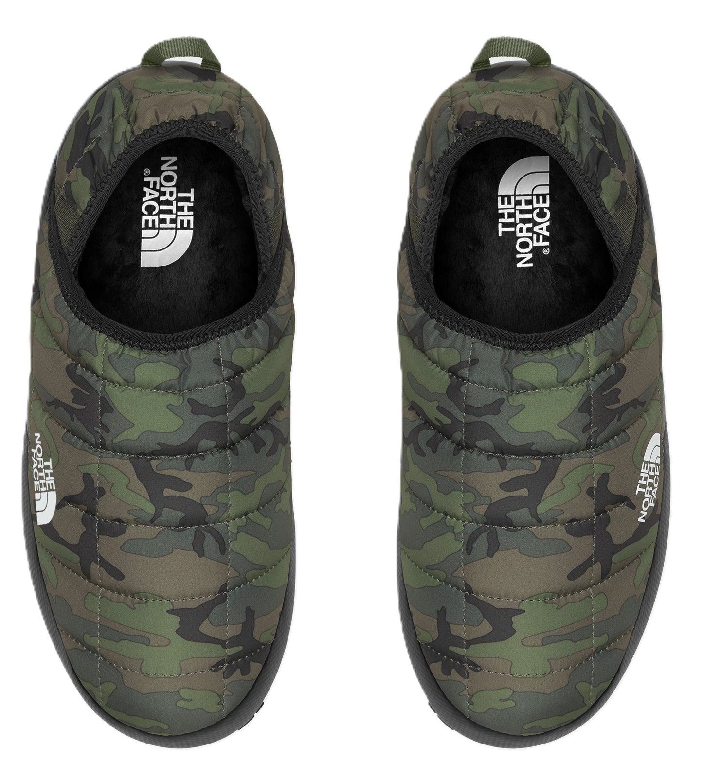 Overhead shot of two camouflage print slipper mules, the white logo is visible on the side of one slipper and the insole of both.