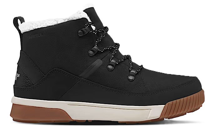 Black high top boot with brown sole, white midsole, and fuzzy white lining.