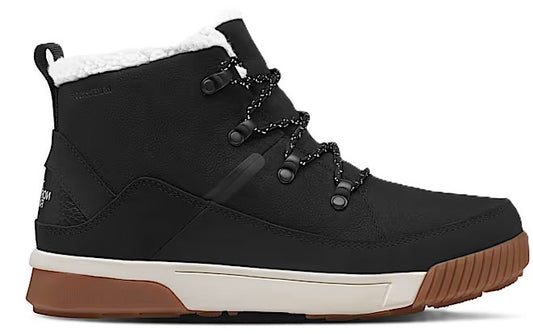 Black high top boot with brown sole, white midsole, and fuzzy white lining.