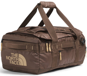 Brown duffel bag with tan text that reads "THE NORTH FACE", and multiple straps and zippers.