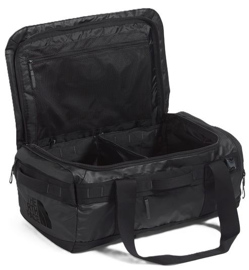Open black duffel bag with carrying straps and interior compartments.