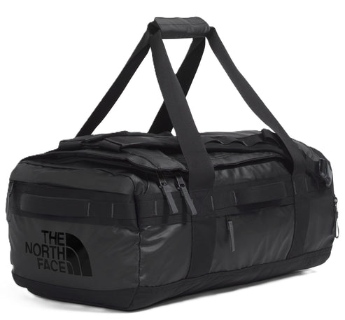 Black duffel bag with 'THE NORTH FACE' printed on the side, equipped with top handles and zippered compartments.