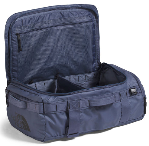 Open dark blue duffel bag with a mesh zipper compartment and adjustable dividers.