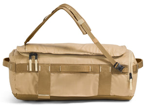 Tan duffel bag with shoulder strap, exterior straps, and zipper pockets.