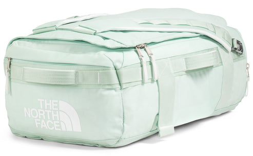 Light green duffel bag with a prominent logo, featuring zippers and straps.