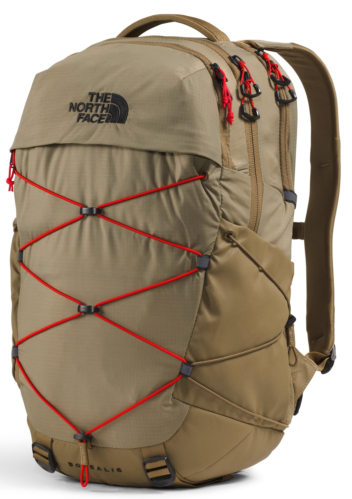 A tan The North Face Borealis backpack shown from a three-quarter angle, featuring a front bungee cord system with bright red cords, black hardware, black zippers with red pull tabs, and a top handle against a white background.
