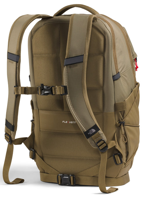 A tan colored backpack shown from the back, featuring padded shoulder straps with a sternum strap, a cushioned back panel with FlexVent branding, and a waist belt with a black buckle.