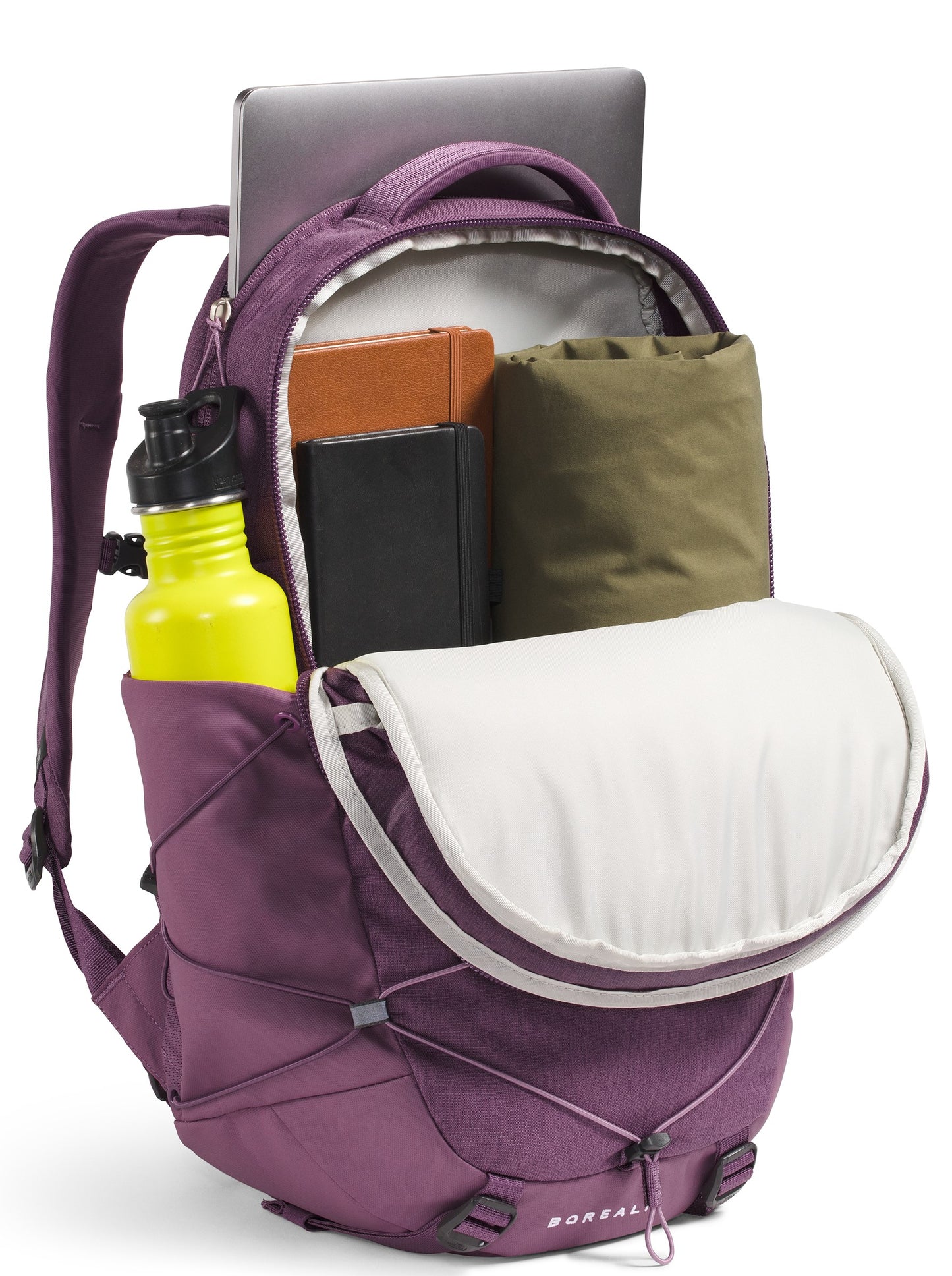 An open purple backpack filled with a laptop, a brown notebook, a small black journal, a rolled olive-green jacket, and a bright yellow water bottle in the side pocket.