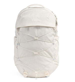 A white backpack with a bungee cord system on the front and a top handle.