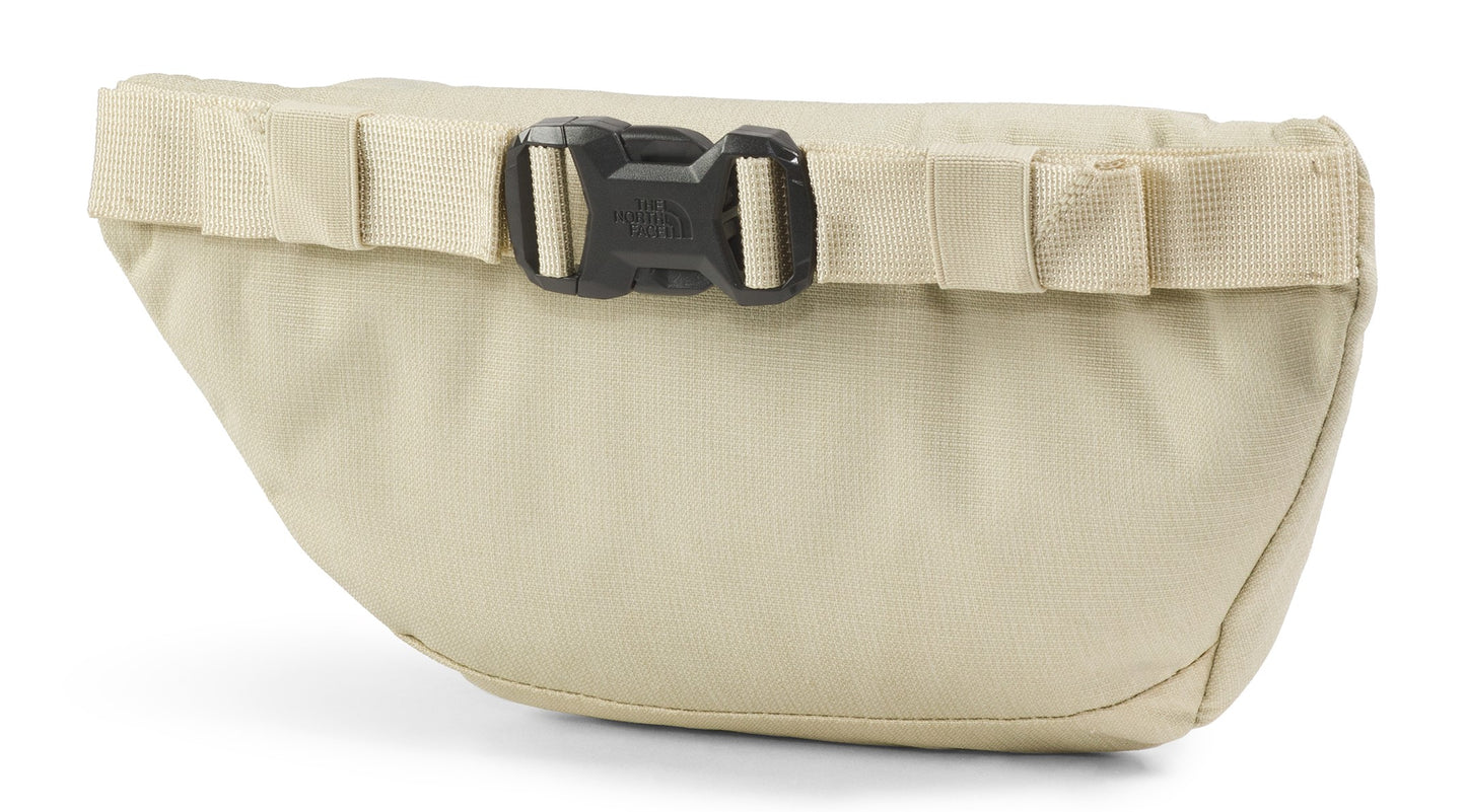 Tan fanny pack with a black buckle.